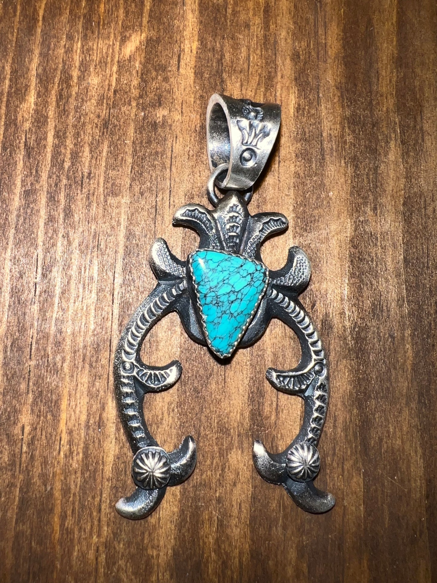 Navajo made sterling silver turquoise naja pendant