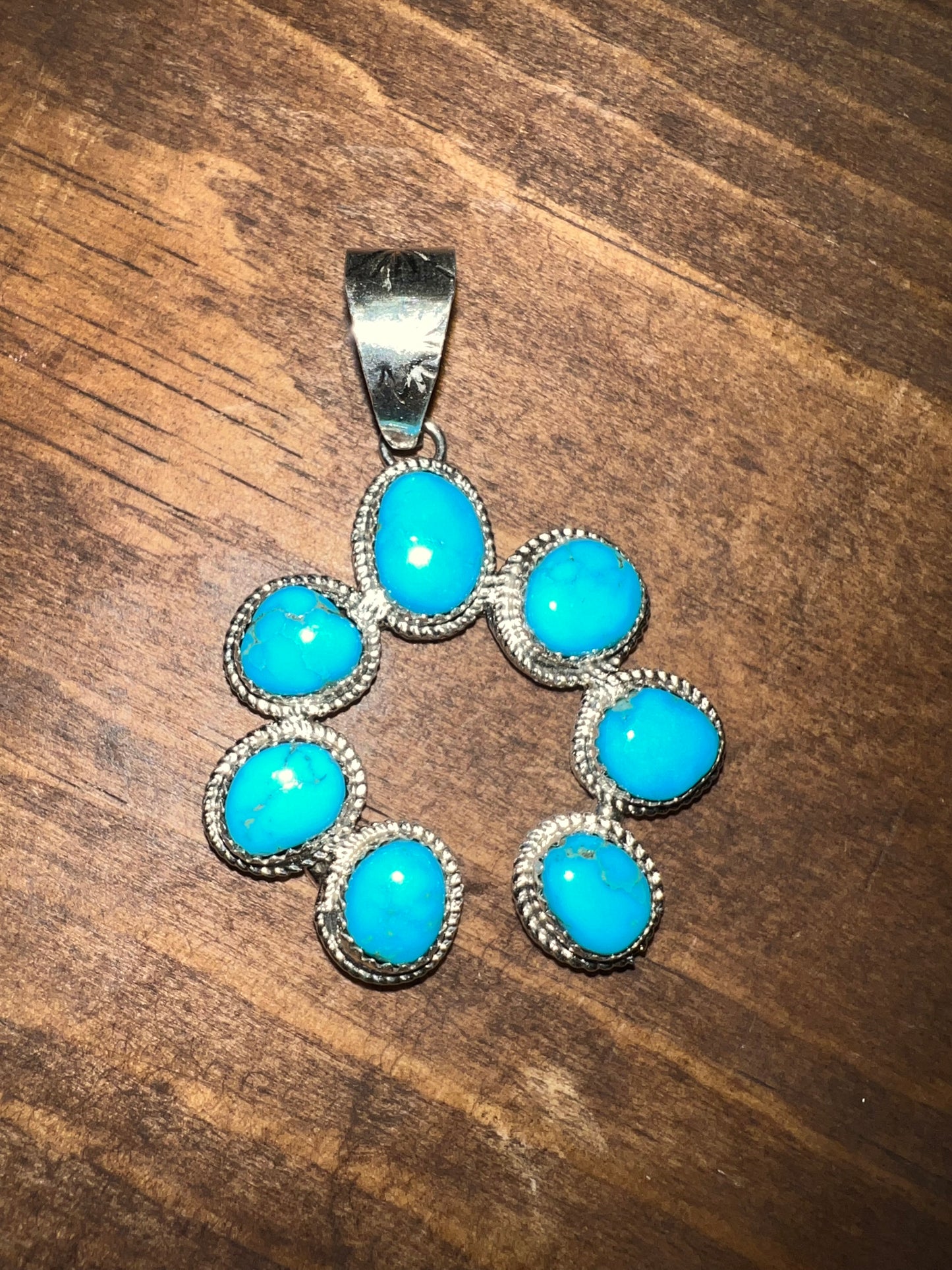 Navajo made sterling silver turquoise naja pendant