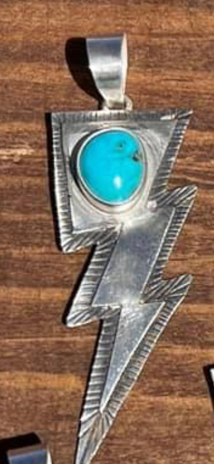 Navajo made sterling silver turquoise lightening bolt pendant