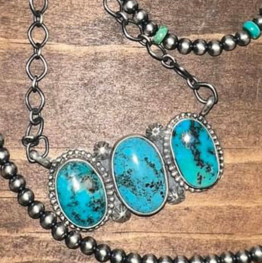 Navajo made sterling silver turquoise three stone necklace