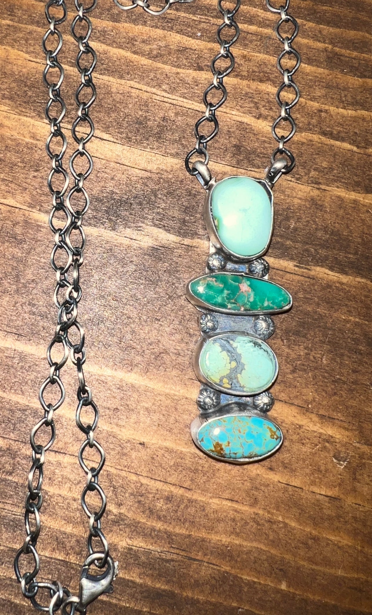 Navajo made sterling silver turquoise four stone necklace