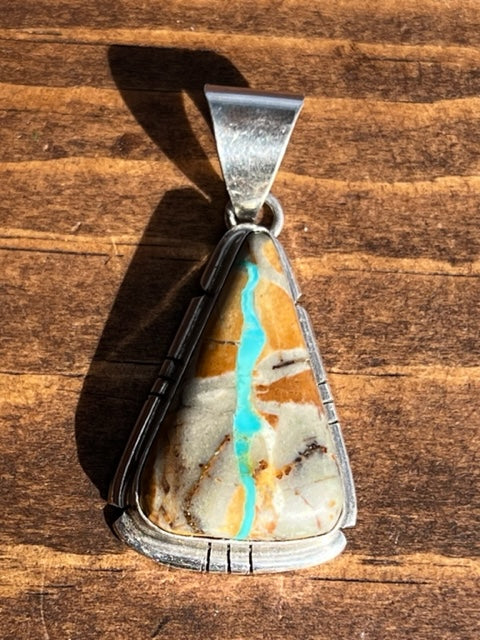 Navajo Made Sterling Silver Ribbon Turquoise Pendant