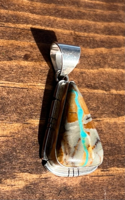 Navajo Made Sterling Silver Ribbon Turquoise Pendant